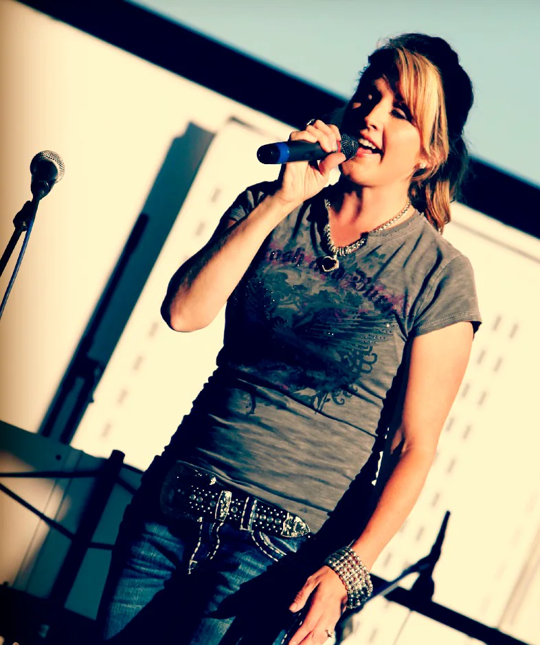 Sunny Miller with a microphone.