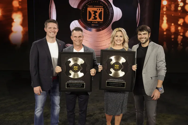 Bart and Sunny Miller receiving a separate Two Comma Club award in 2021 alongside Russell Brunson and Todd Dickerson.